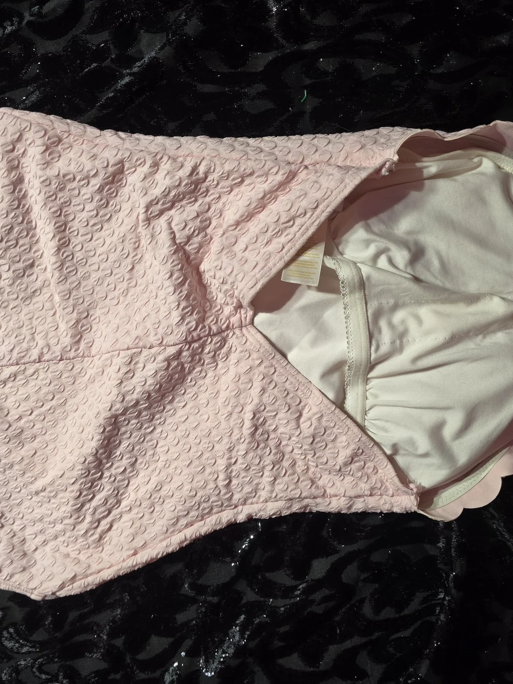 Beautiful Kate Spade New York one-piece swimsuit in a soft baby pink textured